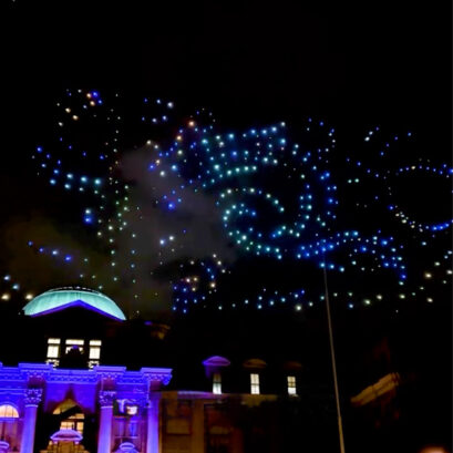 Drones create an image of swirls over mertz library