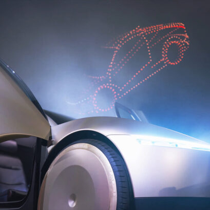 Tesla car and a Tesla car in drones above in the sky